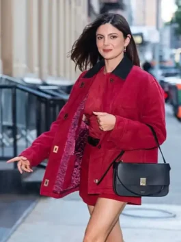 Full-length view of the red cotton Monica Barbaro New York City 2026 Jacket with neat outside pockets.