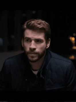 Close-up of the front zipper, snap tab buttons, and stand up collar on the Most Dangerous Game Liam Hemsworth Jacket.