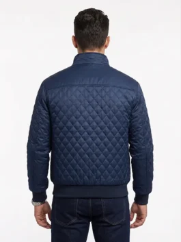 Model view showing the back of the satin navy blue Most Dangerous Game Liam Hemsworth Jacket with rib knitted cuffs.
