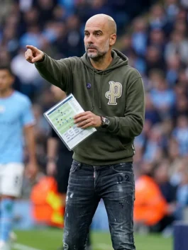 Close-up of the green parachute fabric Pep Guardiola Green Hoodie detailing the hooded collar and front kangaroo pocket.