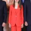 Bold orange Princess Leonor Orange Suit highlighting the sharp single-button blazer and matching full-length trousers.
