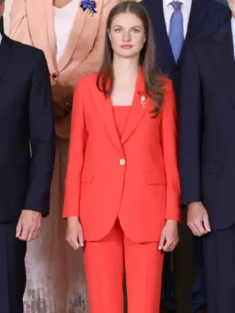 Bold orange Princess Leonor Orange Suit highlighting the sharp single-button blazer and matching full-length trousers.