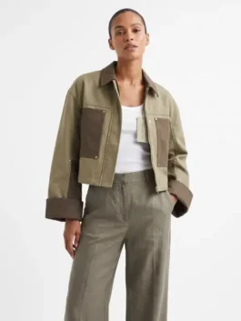 Model view of the green cotton Ransom Canyon S02 Lauren Glazier Jacket displaying full length sleeves and clean tailored lines.