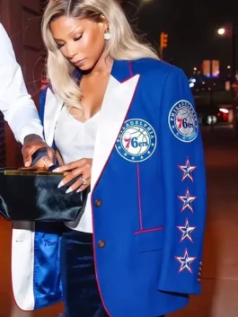 Close-up front view of the blue suiting fabric Savannah James Philadelphia 76ers Blazer detailing the lapel collar and button closure.