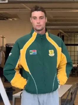 Front view of the green and yellow South Africa Intra Nations Jacket in polyester with a stand up collar.