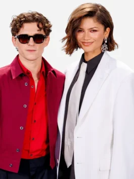 Close-up of the white suiting fabric SpiderMan Photocall NYC Zendaya Blazer detailing the lapel collar and button closure.