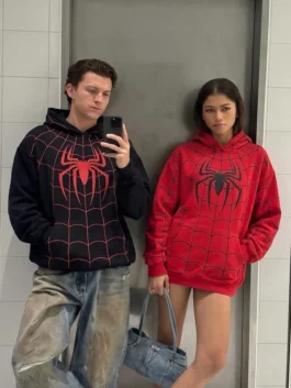 Spiderman Zendaya And Tom Holland Hoodie in red and black polyester highlighting its comfortable pullover front.