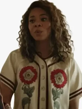 White cotton The Five Star Weekend Regina Hall Floral Top featuring intricate embroidered floral details, a V neck collar, and half length sleeves.