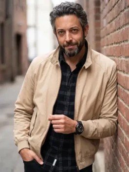 Close-up front profile of the beige cotton The Fix 2026 Zachary Levi Beige Jacket detailing the zipper front and stand up collar.