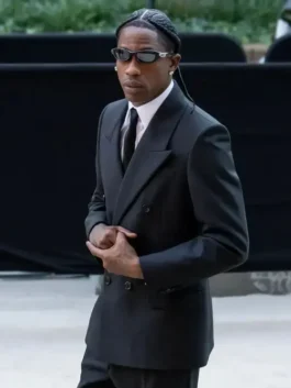 Sleek black suiting fabric The Odyssey New York Premiere Travis Scott Suit featuring a lapel collar and classic button closure.
