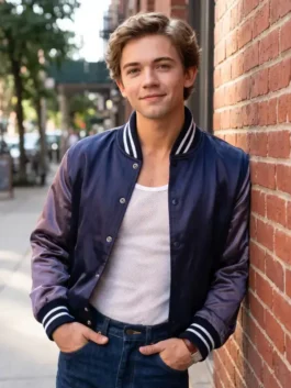 Navy blue satin The Shards Igby Rigney Varsity Jacket featuring a rib knitted collar and snap tab button front.