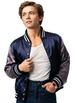 Full front profile of the navy blue satin The Shards Igby Rigney Varsity Jacket highlighting three convenient utility pockets.