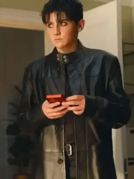 Full-length profile view of the black real leather Trying S05 Tyler Black Leather Coat displaying its long silhouette and button front.