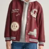 Rich maroon real leather Womens Printed Maroon Varsity Jacket featuring iconic printed graphics and a sleek snap button front.