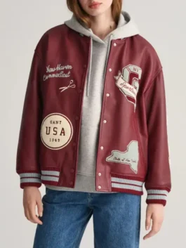 Rich maroon real leather Womens Printed Maroon Varsity Jacket featuring iconic printed graphics and a sleek snap button front.