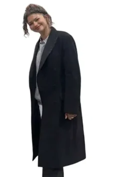 Full view of the long black wool Zendaya Long Black Wool Coat showing its graceful drape and clean stitching.
