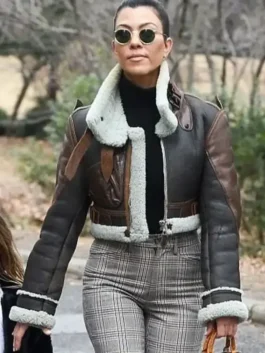 Brown real leather Kourtney Kardashian Shearling Leather Jacket showcasing full length sleeves and shearling cuffs.