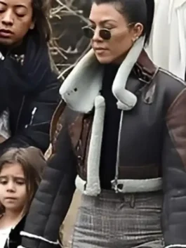 Brown real leather Kourtney Kardashian Shearling Leather Jacket detailing the plush shearling lining and rich leather finish.