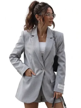 Grey suiting fabric Michelle Keegan Glamour UK Grey Blazer highlighting five functional storage pockets.