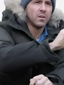 Close-up of the deep forest green cotton Mayday 2026 Ryan Reynolds Parka Jacket detailing the hooded fur collar and front zipper buttons.
