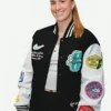 Close-up of the black and white wool and PU leather Sabrina Ionescu Any Time Any Where Varsity Jacket showcasing the rib knitted collar and sleek monochrome finish.