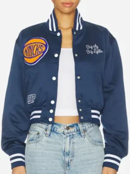 Front view of the blue satin Sophia Bush Knicks Blue Satin Varsity Jacket highlighting three functional storage pockets.