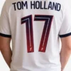 Multicolor polyester Spider-Man PSG Tom Holland Jersey detailing the V-neck collar and half length sleeves.