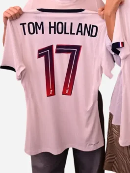 Multicolor polyester Spider-Man PSG Tom Holland Jersey showcasing the V-neck collar and vibrant athletic design.