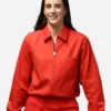 Front view of the red cotton Caitlin Clark All-Star Game Red Jacket highlighting two functional storage pockets.